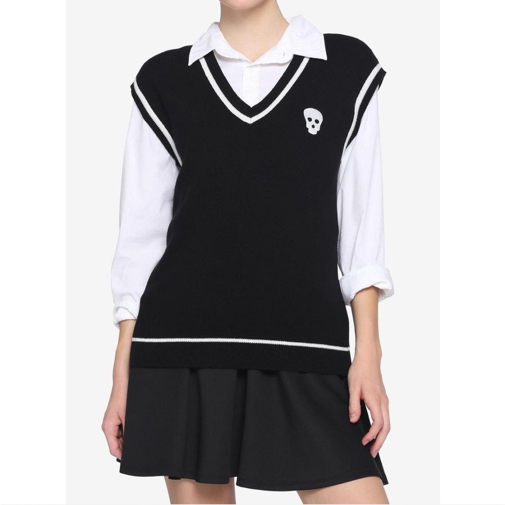 white + black school girl sweater vest with tie